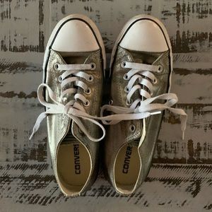 Converse low top silver metallic sneaker.